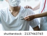 Small photo of Doctor use stethoscope, checking up heart beat, auscultation in doctor office at hospital. Patient worker has to get medical checkup every year for her health or medical checkup cardiologist.