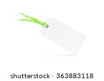 Small photo of Blank white textured tag mock up with riband isolated. Green ribbon with bow on the business shopping card. Empty clothing coupon icon mockup. Clear gift mark label ready for logo design presentation.