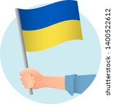 ukraine flag in hand. patriotic ... | Shutterstock .eps vector #1400522612