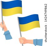 ukraine flag in hand. patriotic ... | Shutterstock .eps vector #1424749862