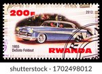 Small photo of MOSCOW, RUSSIA - MARCH 28, 2020: Postage stamp printed in Rwanda shows DeSoto Foldout 1955, Vintage cars serie, circa 2013