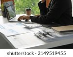 Small photo of Financial advisor using computers Laptop, data acquisition and calculations, numbers, datasheets, graphs, charts, reports, marketing, research, development, planning, management, financial accounting