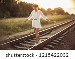 Girl Balancing On Train Rail....