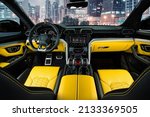 Black and yellow Italian super car suv leather interior high end automotive photography 