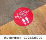 Small photo of London, UK. May 11th 2020: Houndsditch post office. Customer floor sign, warning to stay safe and keep your distance. Lockdown, coronavirus outbreak, safety sticker, social distancing in a public area