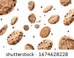 Collection of half chocolate chip cookies on white background