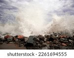 Small photo of The waves brack down on rocks and splashes goes around of beach. Usually, the calm sea, but this time looks pretty terrifying but beautiful. Catches the eye a view of the Black Sea, Crimea, Ukraine
