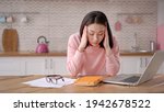 Small photo of Bored sleepy asian lady sitting at desk with laptop, holding head, resting on hand, sleeping at workplace, tired young female feeling drowsy, lazy and unmotivated student, boring job, lack of sleep