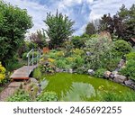 A garden pond with a small...