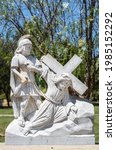 Small photo of Santa Inez, CA, USA - April 3, 2009: San Lorenzo Seminary. Station of the Cross number 3 white marble statue. Jesus falls first time. Under blue sky with green foliage in back.