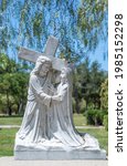 Small photo of Santa Inez, CA, USA - April 3, 2009: San Lorenzo Seminary. Station of the Cross number 4 white marble statue. Jesus meets mother. Under blue sky with green foliage in back.