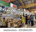 Small photo of Kiosk of seller in Ben Thanh Market (Cho Ben Thanh), Ho Chi Minh City, Vietnam, on August 18, 2023. Saigon. Candy stall. Coffee stall. Peanut stall. Fruit stall.