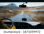 Focus on view from inside adventure car or camper van on amazing cinematic scandinavian landscape. Travel on epic road trip through mountains. Nomadic vanlife lifestyle. Life on the road