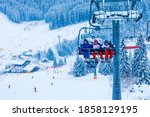 backlit scenes with ski lift chairs on hillside, Levi ski resort, Finland