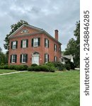 Small photo of Glastonbury, Connecticut, USA - August 17, 2023: Former Parsonage and later private home. Built in 1828. Vintage, red brick house located on Main Street in historic district. Empty space for copy.