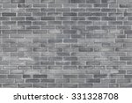 Grey brick wall texture background. Tiled.
