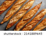 Freshly baked baguette on great background, top view