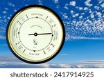 Small photo of a modern tide clock on a sky background