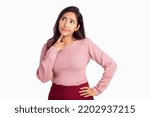 Small photo of Worried young woman thinking on white background.