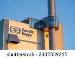 Small photo of Pitea, Sweden - February 20, 2023: Pulp and paper industry Smurfit Kappa Factory using Wood as raw material for cellulose-based products, in Town Pitea, Sweden.