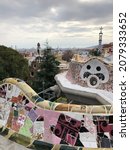 Small photo of Barcelona, Spain - November 2021: Incredible mosaic in Park Guell. Architecture and gardens of this park is the Worlds Heritage and belong to works of Antonia Gaudi. Artistic and inspirational place.