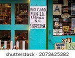 Small photo of New York NY USA-November 11, 2021 A sign outside of a restaurant in Chelsea in New Yorkinforms diners that proof of vaccination and identification is required for entry