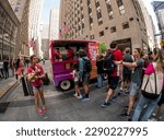 Small photo of New York NY USA-April 14, 2023 Free soft serve ice cream at a brand activation in Rockefeller Center for the young adult fiction writer, Maurene Goo and her new novel Throwback
