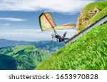 Hang Glider Pilots Runs From...