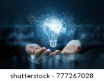 Light bulb with brain inside the hands of the businessman. The concept of the business idea.