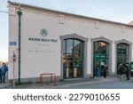 Small photo of Marseillan, France - December 30, 2018: architecture detail the the facade of Maison Noilly Prat - boutique cocktail bar museum in the city center on a winter day