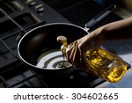 Pouring vegetable oil into frying pan