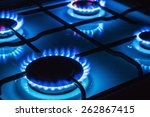 Burning blue gas. Focus on the front edge of the gas burners