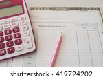 Small photo of notebook years cash account balance brought forward income and expenses