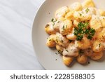 Gnocchi with mushroom cream sauce and cheese - Italian food style