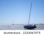 Sailboat Stranded At Low Tide