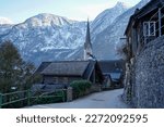 Hallstatt, Austria - March 2023: Nice view of the city. Mountain Lake. Lake among the mountains. Huts in the mountains near the forest lake.