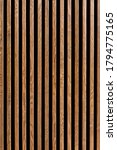 Small photo of Vertical wooden slats of dark wood lath for background.