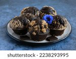 Chocolate muffins with streusel on the plate