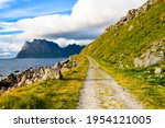 Hiking path and beautiful coastline at Uttakleiv Beach. Famous and attraction place at Lofoten islands, Norway.Natural background