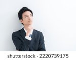 Young businessman thinking on white back ground