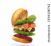 Small photo of Delicious burger with flying ingredients isolated on white