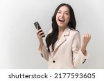 Small photo of Portrait photo of young beautiful Asian woman feeling happy or surprise shock and holding smart phone on white background can use for advertising or product presenting concept.