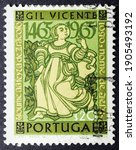 Small photo of MADRID, SPAIN - JANUARY 24, 2021. Vintage stamp printed in Portugal shows woman for the 500th Birth Anniv of Gil Vicente (1465 - 1536), poet and dramatist