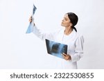 Small photo of Woman doctor holding X-ray in robe on white background, consequences of covid-19, pneumonia and lung damage, concept of health