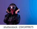 Small photo of Crazy pretty awesome brunet woman in leather jacket trendy specular sunglasses scream spread hands posing isolated in blue violet color light background. Neon party Cyberpunk concept. Copy space