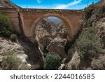 stone bridge over deep ravine in Granada