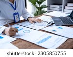 Accountant using calculator and writing on paper, Business woman working audit calculating price taxes loan rates, bookkeeper or financial inspector hand making result