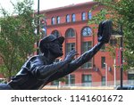 Small photo of ST. LOUIS - SEPTEMBER 18: Ozzie Smith Statue outside Busch Stadium, home of the Cardinals, on September 18, 2010 in St. Louis. Opened in 2006, it seats 43,975 and cost $365 million.