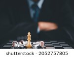 Small photo of Businessman moves chess with hand.Strategic planning concept about mistakes topple the opposing team and analyze the development for the success of the organization.