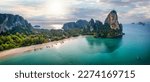 Small photo of Panoramic aerial view of the beautiful Railay beach, Krabi, Thailand, lush rain forest and emerald sea during morning sunrise without people